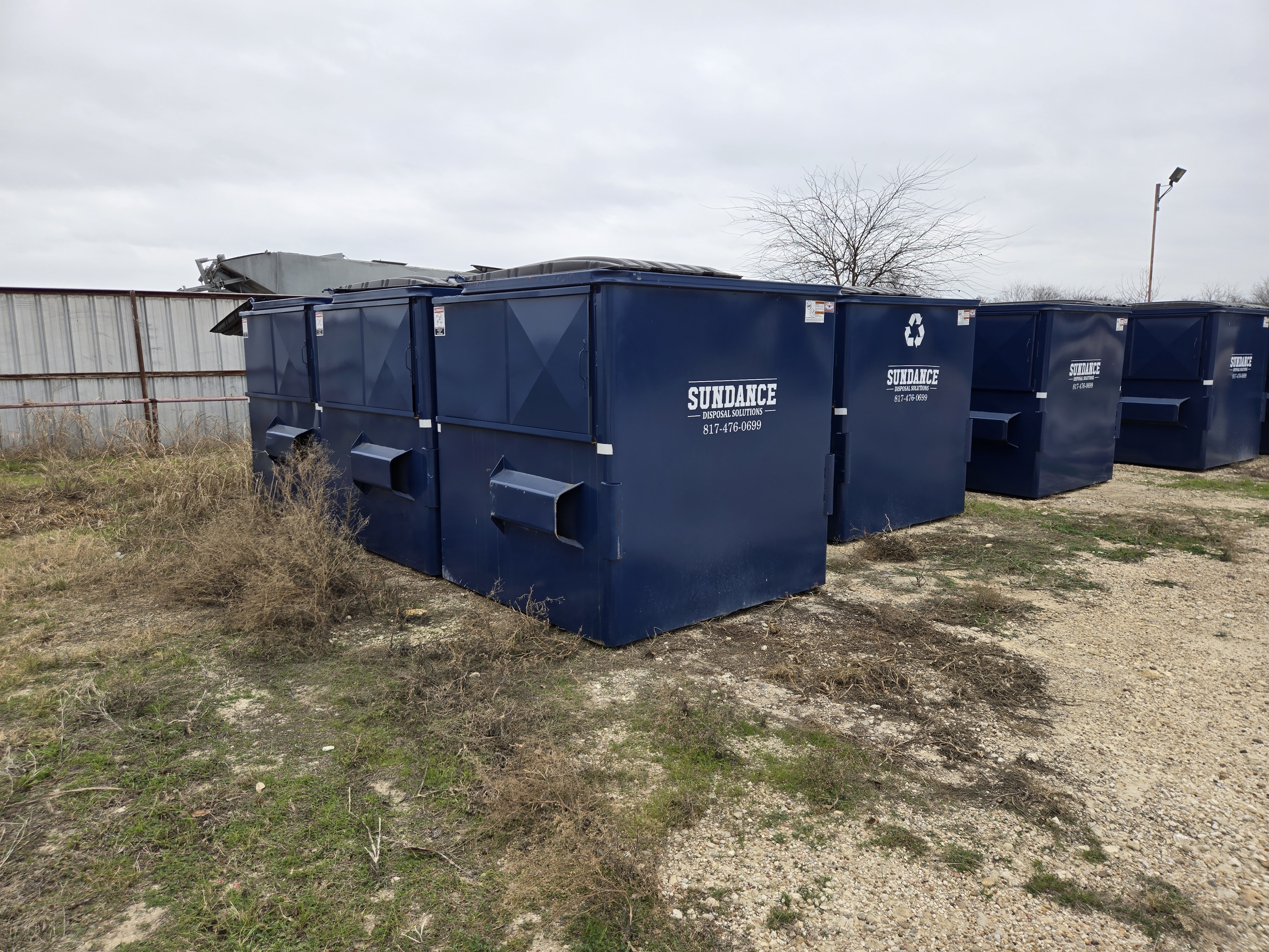 Front-load dumpster at commercial property
