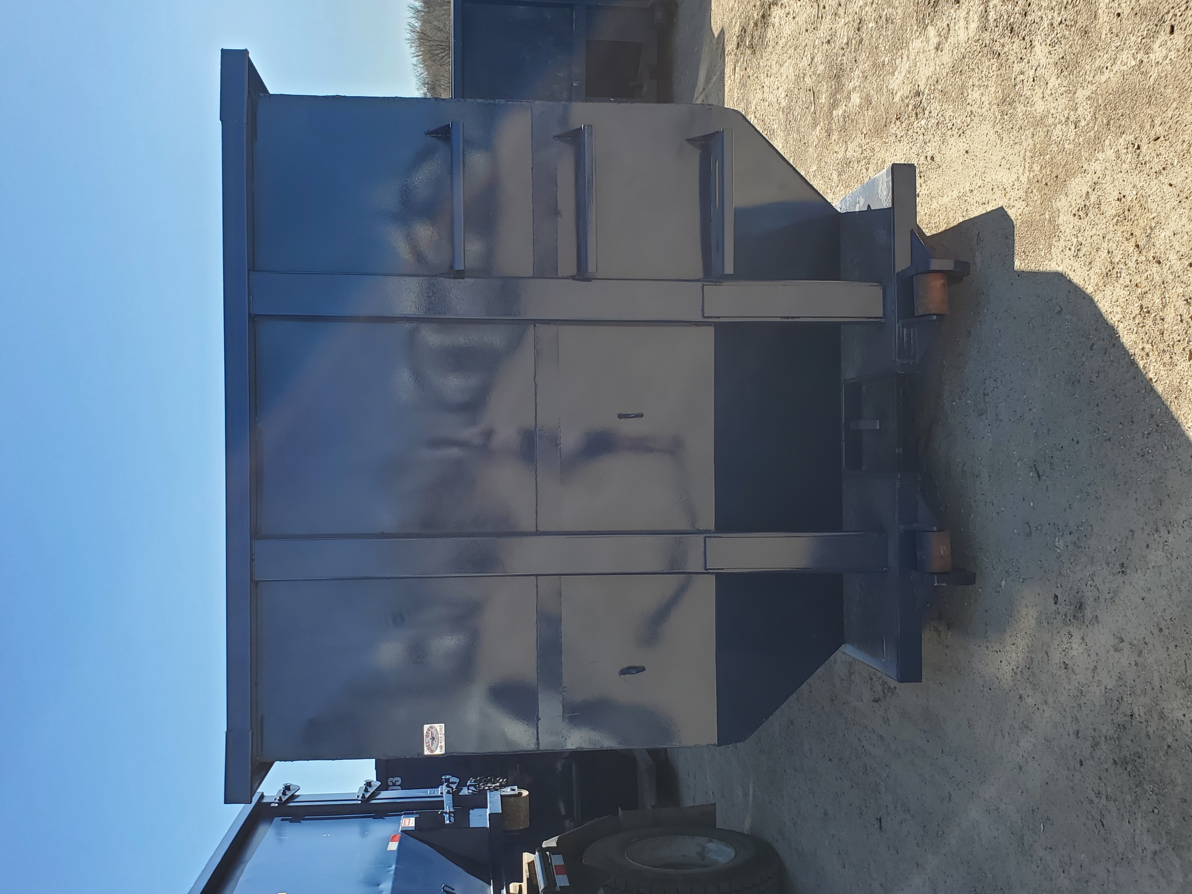 Roll-off dumpster loading
